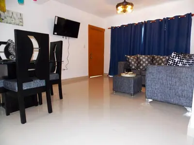 a living room with a couch and chairs and a tv at Cañaveral Del Mar 1 Quiet and extremally relaxing! in San Felipe de Puerto Plata