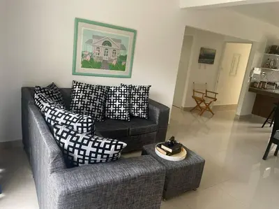 a living room with a couch and pillows at Cañaveral Del Mar 1 Quiet and extremally relaxing! in San Felipe de Puerto Plata
