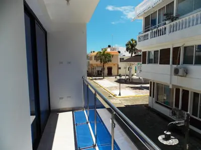 a balcony of a building with a view of a street at Residencial Victoria in Sampiño