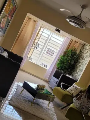a living room with a couch and a window at comodidad y tranquilidad in Mendoza
