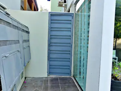 an open door on the side of a building at Villa Olga Studio in Rincón Largo