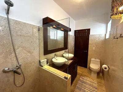 a bathroom with a sink and a toilet and a shower at Villa 4Bdrms 3.5baths with pool, Jacuzzi and Starlink WiFi in Las Terrenas
