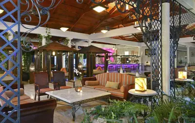 a living room with a couch and a table at Paradisus Punta Cana Resort All Inclusive in Punta Cana