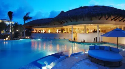 a resort with a swimming pool at night at The Reserve at Paradisus Punta Cana - All Inclusive in Punta Cana