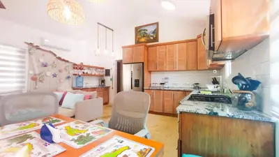 a kitchen with a table and a counter top at Brisa Atlántico - Secluded Beach in La Piña