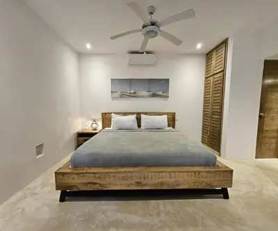 a bedroom with a bed with a ceiling fan at Villa Vista in Las Terrenas