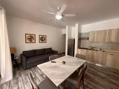 a living room with a table and a couch at Residencial Paraiso C102 in Bayahibe