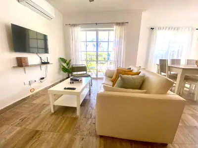 a living room with a couch and a table at The Perfect Place for Holiday in los Corales RD in Punta Cana