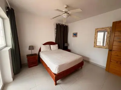 a bedroom with a bed and a ceiling fan at Residencial Paraíso A101 in Bayahibe