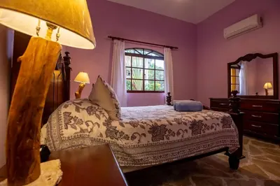 a bedroom with a bed and a window at Cabarete Oceanview Villa Pool Oasis Beach Access in Cafemba