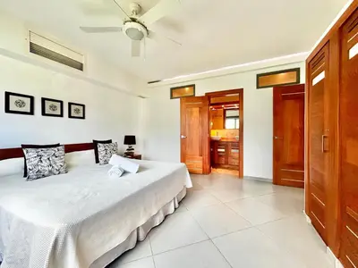a bedroom with a bed and a ceiling fan at Beachfront complex 3BD 3BA with pool in Las Terrenas