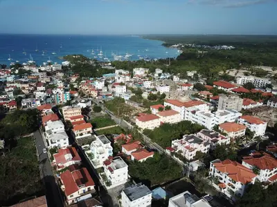 an aerial view of a city with buildings and the ocean at Apartamento Aurora in Bayahibe