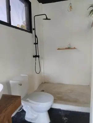 a bathroom with a toilet and a shower at Casa Santa la laguna in La Aguada