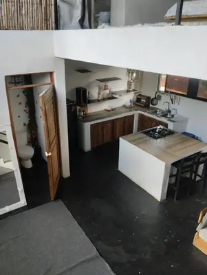 a small kitchen with a sink and a table at Casa Santa la laguna in La Aguada
