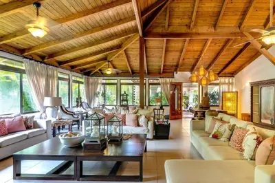 a living room with a couch and a table at Villa Cajuiles 13, Casa de Campo in La Romana