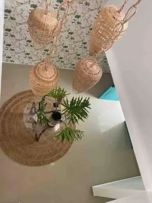 a room with wicker baskets hanging from the ceiling at Hermosa villa en metro country club Juan dolio in Paraíso