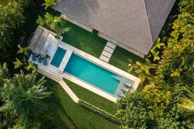an overhead view of a house with a swimming pool at Villa Laguna, Lush Oasis In Casa De Campo in La Romana