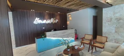 a lobby with a waiting area with chairs and a table at Boca del Mar III, Boca Chica in Boca Chica