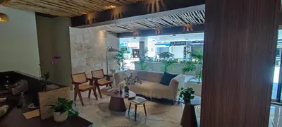 a living room with a couch and some tables and chairs at Boca del Mar III, Boca Chica in Boca Chica