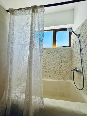 a shower curtain in a bathroom with a tub at Suami s room Casa Padura in Cabarete