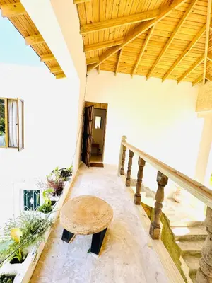 a staircase of a house with a wooden table at Suami s room Casa Padura in Cabarete
