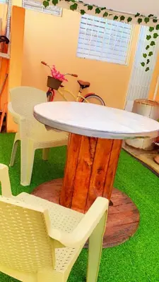 a table with two chairs and a table with a white table at Tropical Estudio En El Centro De La Ciudad in San Felipe de Puerto Plata