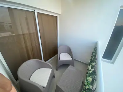 a hospital room with two chairs and a window at Apartamento completo en Bayahibe in Bayahibe