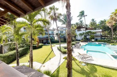an aerial view of a villa with a swimming pool and palm trees at Penthouse frente al mar Playa Las Ballenas in Las Terrenas