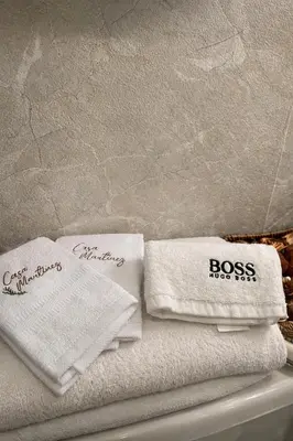 two towels are sitting on top of a shelf at casa Martinez refugio sereno in Santiago de los Caballeros