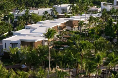 an aerial view of a building with palm trees at Donoma Las Terrenas Beach Hotel & Spa, Autograph Collection in Las Terrenas