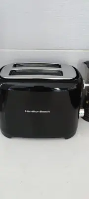 a black toaster sitting on top of a counter at Caribe Home Dominicus Oleandra 3 in La Laguna