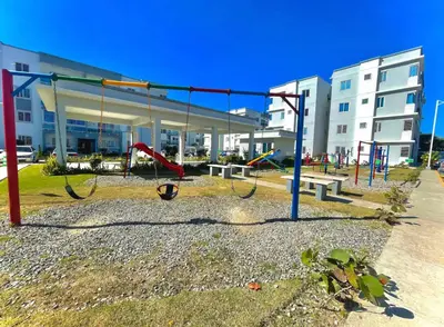 an empty playground in front of a building at Sol tropical in La Grúa