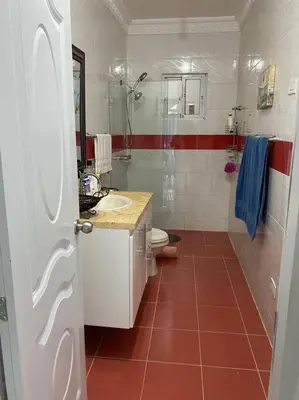 a bathroom with a toilet and a sink and a shower at Modern Country Side Lux Apt in La Ceibita
