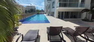 a swimming pool in the middle of a building at Boca del Mar III, apartamento 411 in Boca Chica