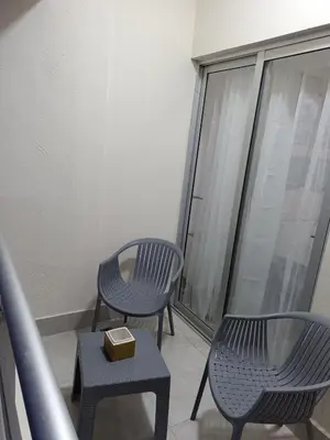 a balcony with two chairs and a box on a table at Boca del Mar III, apartamento 707 in Cuevas