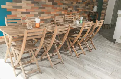 a wooden table and chairs in a room at Casa de Huespedes Colonial in Santo Domingo