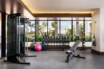 a fitness room with a gym with exercise equipment at Hotel Santiago, Curio Collection By Hilton in Santiago de los Caballeros