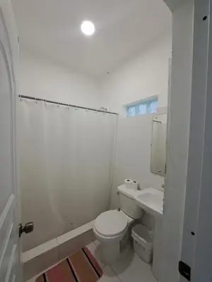 a white bathroom with a toilet and a sink at Cabrera 6 in Cabrera