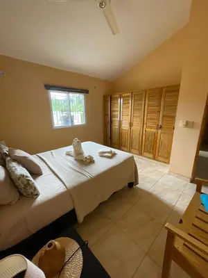 a bedroom with a bed with towels on it at Villa Karolina in Las Galeras