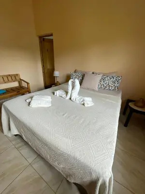 a bedroom with a bed with towels on it at Villa Karolina in Las Galeras