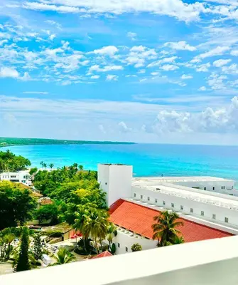 a view of the ocean from the balcony of a building at Luxury Penthouse DGM Resort at Boca del mar III, Boca Chica in Boca Chica