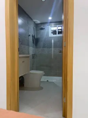 a bathroom with a shower and a toilet in it at Modern House in Santo Domingo Este in Juan López