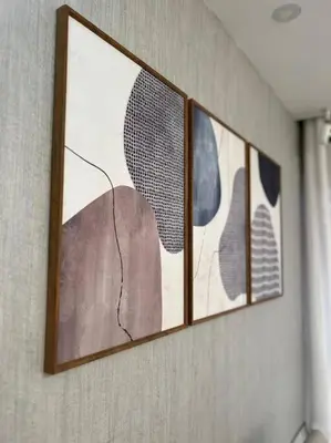 a group of four pictures hanging on a wall at Encantador y lujoso apartamento in San Pedro de Macorís