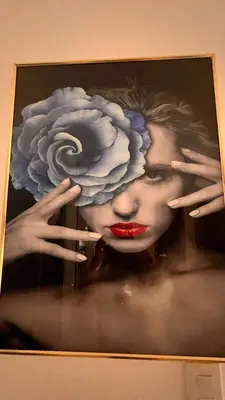 a painting of a woman with a flower on it at Crown lll with Pool -3 Bedrooms close to Everything in Puerto Plata