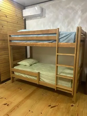 a couple of bunk beds in a room at Villa Naturaleza y confort in Santiago de los Caballeros