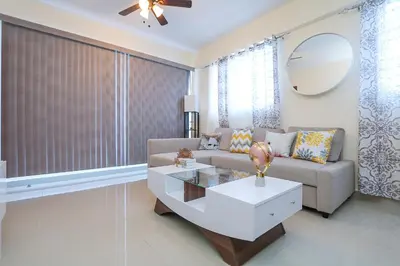 a living room with a couch and a table at Edificio Amber 1 in San Cristóbal