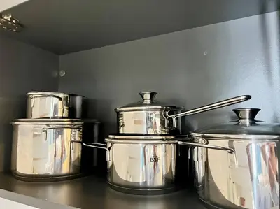 three pots and pans sitting on a kitchen counter at AD-301 Ático Duplex Estrella Dominicus in La Laguna