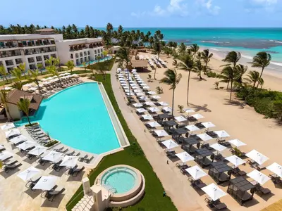 an aerial view of a resort with a swimming pool and the beach at Secrets Playa Esmeralda Resort & Spa - All Inclusive in Miches
