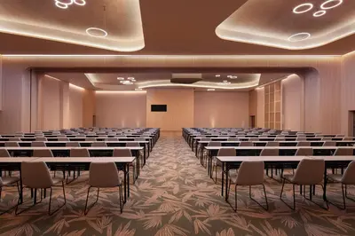 a conference room with rows of tables and chairs at Dreams Playa Esmeralda Resort & Spa - All Inclusive in Miches