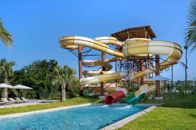 a water slide at a resort with a pool at Dreams Playa Esmeralda Resort & Spa - All Inclusive in Miches
